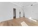 Spacious bedroom with hardwood floors and multiple doorways at 5006 W San Miguel St, Tampa, FL 33629