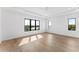 Spacious bedroom featuring hardwood floors and large windows with a water view at 5006 W San Miguel St, Tampa, FL 33629