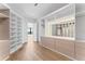 Spacious walk-in closet featuring custom shelving, storage, and wood flooring at 5006 W San Miguel St, Tampa, FL 33629