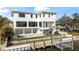 Stunning waterfront home with a private dock, backyard pool, and modern architecture at 5006 W San Miguel St, Tampa, FL 33629