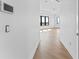 Hallway leading to a bright room with large windows and a water view at 5006 W San Miguel St, Tampa, FL 33629