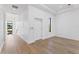 Bright hallway with hardwood floors and modern white doors and trim at 5006 W San Miguel St, Tampa, FL 33629