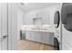 Modern laundry room featuring sleek appliances and ample counter space at 5006 W San Miguel St, Tampa, FL 33629