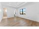 Spacious main bedroom features hardwood floors, recessed ceilings, and a large window with neighborhood views at 5006 W San Miguel St, Tampa, FL 33629