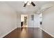 Bedroom featuring hardwood floors, a ceiling fan, and an open doorway to a bathroom at 8693 Bardmoor Blvd # 308B, Seminole, FL 33777