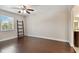 Spacious bedroom with hardwood floors and ladder beside a window at 8693 Bardmoor Blvd # 308B, Seminole, FL 33777