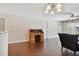 Spacious living room with hardwood floors, desk, and neutral color palette at 8693 Bardmoor Blvd # 308B, Seminole, FL 33777