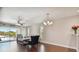 Inviting living room with a ceiling fan, comfortable seating, and a balcony offering scenic views at 8693 Bardmoor Blvd # 308B, Seminole, FL 33777
