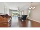 Bright living room featuring hardwood floors, a ceiling fan, and sliding glass doors at 8693 Bardmoor Blvd # 308B, Seminole, FL 33777