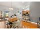 Cozy dining area connected to kitchen features hardwood floors and natural light at 32124 Corbin Ridge St, San Antonio, FL 33576