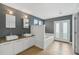 Modern bathroom with double sinks, soaking tub, and private access at 212 S Moody Ave # 2, Tampa, FL 33609