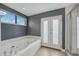 Bathroom with soaking tub and private access at 212 S Moody Ave # 2, Tampa, FL 33609