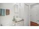 Small bathroom with granite vanity, sink, and toilet at 212 S Moody Ave # 2, Tampa, FL 33609