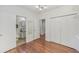 Well-lit bedroom with hardwood floors and built-in closet at 212 S Moody Ave # 2, Tampa, FL 33609