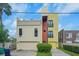 Contemporary three-story home with attached garage and city views at 212 S Moody Ave # 2, Tampa, FL 33609