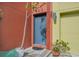 Modern gray front door with a red brick accent wall at 212 S Moody Ave # 2, Tampa, FL 33609