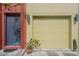 Attached garage with light yellow door and modern lighting at 212 S Moody Ave # 2, Tampa, FL 33609