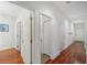 Bright hallway with hardwood floors and access to multiple rooms at 212 S Moody Ave # 2, Tampa, FL 33609