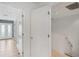 Clean hallway with white doors and tiled floors leading to other rooms at 212 S Moody Ave # 2, Tampa, FL 33609