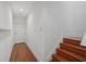 Clean hallway with hardwood floors and white walls at 212 S Moody Ave # 2, Tampa, FL 33609