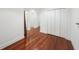 Clean hallway with hardwood floors and white walls at 212 S Moody Ave # 2, Tampa, FL 33609