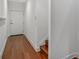 Clean hallway with hardwood floors and white walls at 212 S Moody Ave # 2, Tampa, FL 33609