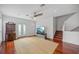 Bright living room with hardwood floors, a ceiling fan and stairs to upper level at 212 S Moody Ave # 2, Tampa, FL 33609