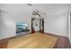 Open living room with hardwood floors and modern ceiling fan at 212 S Moody Ave # 2, Tampa, FL 33609