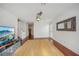Spacious living area with hardwood floors, a large mirror, and access to the kitchen at 212 S Moody Ave # 2, Tampa, FL 33609