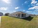 Single-story home with covered patio and backyard at 11818 Tetrafin Dr, Riverview, FL 33579