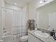 Clean bathroom with granite countertop and shower/tub at 11818 Tetrafin Dr, Riverview, FL 33579