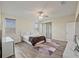 Comfortable bedroom with wood-look floors, window blinds and access to the backyard at 11818 Tetrafin Dr, Riverview, FL 33579