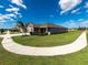 One-story house with a two-car garage and a curved sidewalk at 11818 Tetrafin Dr, Riverview, FL 33579