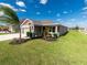 One-story house with a two-car garage, and well maintained lawn at 11818 Tetrafin Dr, Riverview, FL 33579