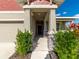 Front porch with stone accents and lush landscaping at 11818 Tetrafin Dr, Riverview, FL 33579