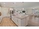 Open concept kitchen features a large island, granite countertops, and stainless steel appliances at 11818 Tetrafin Dr, Riverview, FL 33579