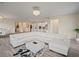 Open concept living room with a large sectional sofa and hardwood floors at 11818 Tetrafin Dr, Riverview, FL 33579