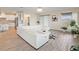 Spacious living room features a large sectional sofa and hardwood floors at 11818 Tetrafin Dr, Riverview, FL 33579