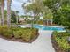 Community pool with lounge chairs and landscaping at 11818 Tetrafin Dr, Riverview, FL 33579