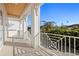 White balcony with tiled flooring and view of the neighborhood at 3011 W Asbury Pl, Tampa, FL 33611