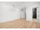 Bright bedroom with hardwood floors and ensuite bathroom at 3011 W Asbury Pl, Tampa, FL 33611