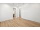 Spacious bedroom with hardwood floors and access to another room at 3011 W Asbury Pl, Tampa, FL 33611