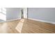 Spacious bedroom with hardwood floors and access to another room at 3011 W Asbury Pl, Tampa, FL 33611