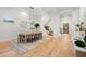 Open concept dining room with hardwood floors and stylish decor at 3011 W Asbury Pl, Tampa, FL 33611