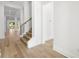 Light-filled entryway with hardwood floors and staircase leading to upper level at 3011 W Asbury Pl, Tampa, FL 33611