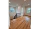 Upstairs hallway with hardwood floors and access to bedrooms at 3011 W Asbury Pl, Tampa, FL 33611