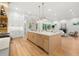 Open concept kitchen with island and hardwood floors at 3011 W Asbury Pl, Tampa, FL 33611