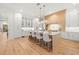 Spacious kitchen with white and light wood cabinets, and a large island at 3011 W Asbury Pl, Tampa, FL 33611