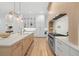 Modern kitchen with stainless steel appliances and white cabinets at 3011 W Asbury Pl, Tampa, FL 33611