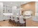 Spacious kitchen with white and light wood cabinets, and a large island at 3011 W Asbury Pl, Tampa, FL 33611